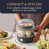 imageElite Gourmet EGC322CW Easy Egg Cooker Electric 7Egg Capacity Soft Medium HardBoiled Egg Cooker with Auto ShutOff Measuring Cup Included BPA Free Classic WhiteBlack