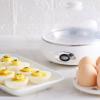 imageElite Gourmet EGC322CW Easy Egg Cooker Electric 7Egg Capacity Soft Medium HardBoiled Egg Cooker with Auto ShutOff Measuring Cup Included BPA Free Classic WhiteClassic White
